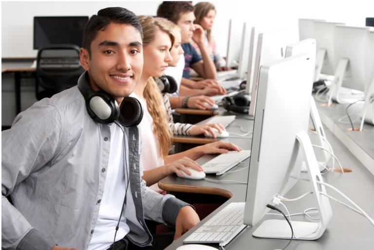 Picture of Young Male in computer lab smiling