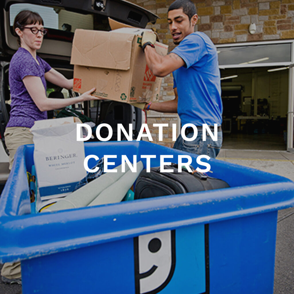 Donation Centers Button. Female Donating to Goodwill. Male employee helping unload car.