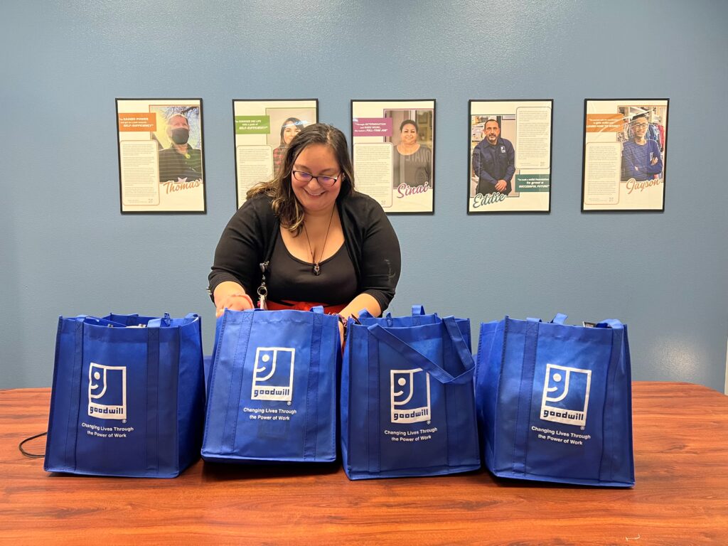 Goodwill Employee putting together ready to go bags for participants in our pathway home.